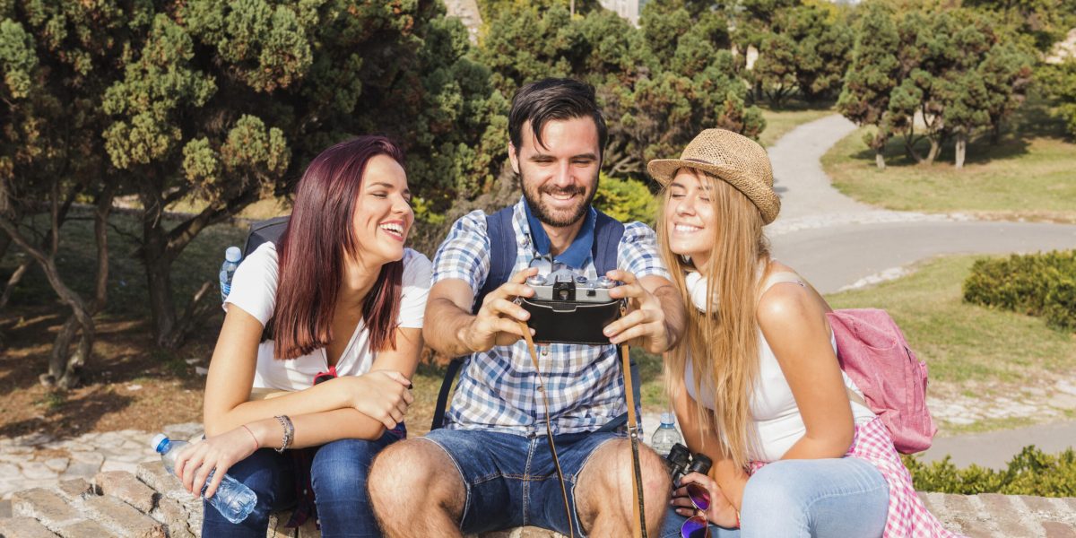 group-happy-friends-taking-photo-camera